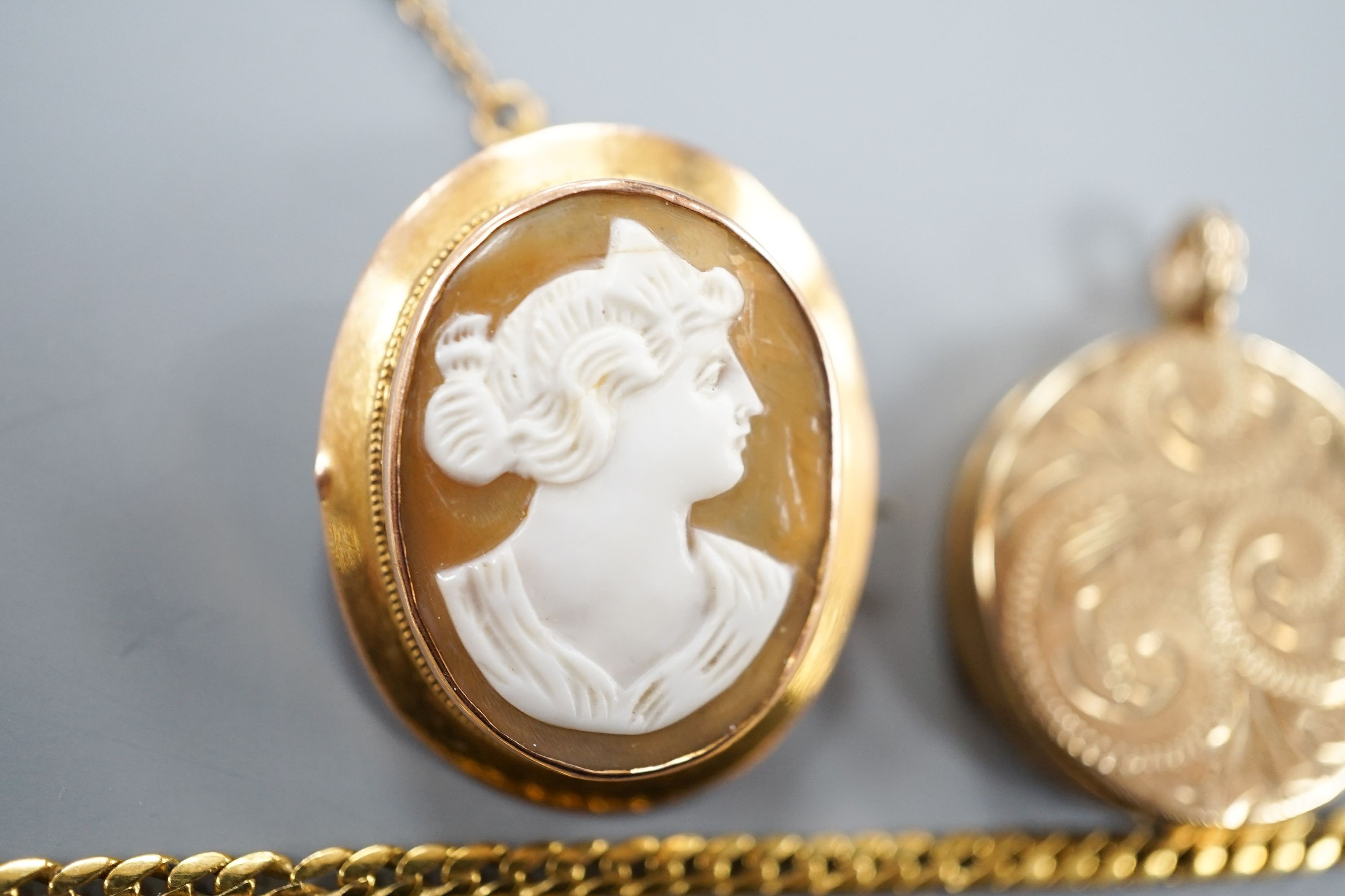 A 9ct gold 'serpent' necklet, 36cm, a 9ct mounted oval cameo shell brooch, a modern 9ct gold locket on a 9ct gold chain, gross 22.1 grams.